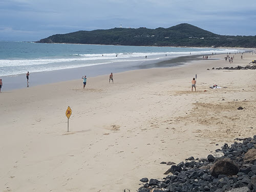 Beach at Byron Bay with lighthouse in the background
