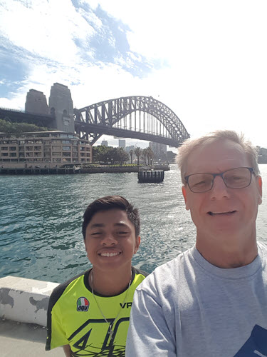 We posing in front of Sydney Harbour Bridge